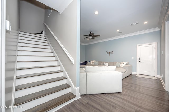 2011 Ivy Ct, Biloxi, MS 39532 - living area featuring crown molding, visible vents, a ceiling fan, and stairway