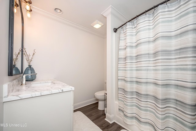 2011 Ivy Ct, Biloxi, MS 39532 - full bathroom featuring toilet, wood finished floors, vanity, crown molding, and baseboards
