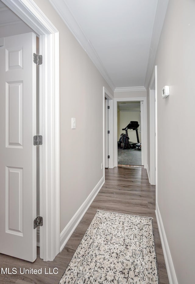 2011 Ivy Ct, Biloxi, MS 39532 - corridor featuring baseboards, dark wood finished floors, and crown molding