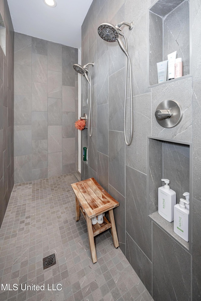 2011 Ivy Ct, Biloxi, MS 39532 - full bathroom featuring a tile shower, tile walls, and recessed lighting