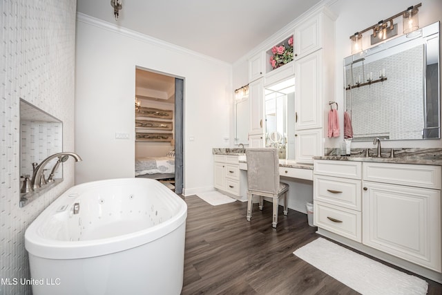 2011 Ivy Ct, Biloxi, MS 39532 - full bath with a sink, wood finished floors, crown molding, a soaking tub, and two vanities