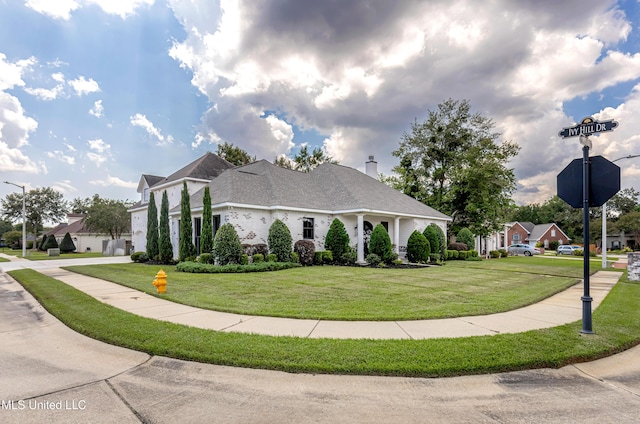 2011 Ivy Ct, Biloxi, MS 39532 - view of side of property with a lawn, driveway, a residential view, and a garage