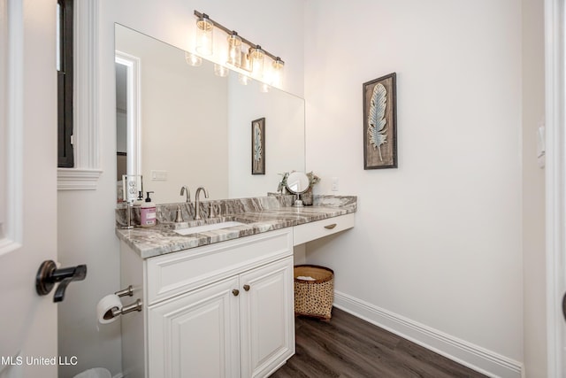 2011 Ivy Ct, Biloxi, MS 39532 - bathroom with vanity, baseboards, and wood finished floors