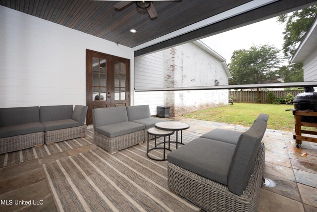 2011 Ivy Ct, Biloxi, MS 39532 - view of patio with ceiling fan, fence, outdoor lounge area, and french doors
