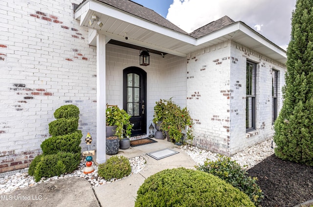 2011 Ivy Ct, Biloxi, MS 39532 - doorway to property featuring a shingled roof and brick siding