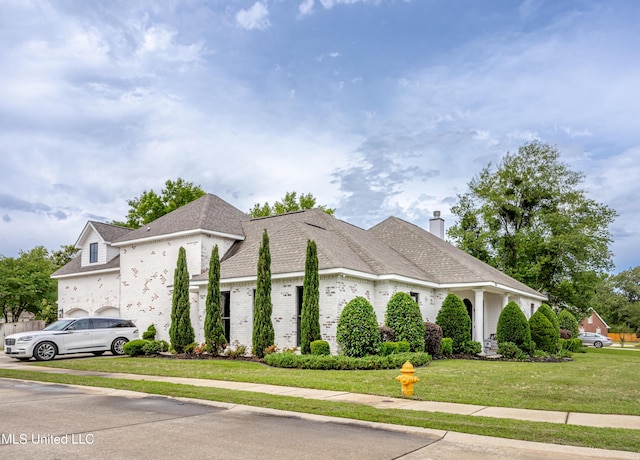2011 Ivy Ct, Biloxi, MS 39532 - view of front of house featuring a front lawn and a chimney