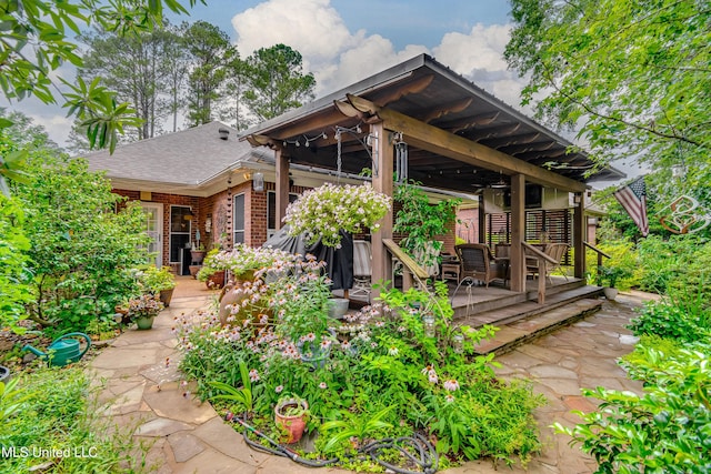 3 Carriage Court Pl, Brandon, MS 39047 - back of house with brick siding, a wooden deck, and roof with shingles