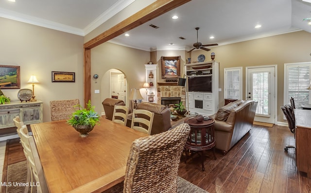 3 Carriage Court Pl, Brandon, MS 39047 - dining area with arched walkways, a ceiling fan, a fireplace, dark wood-style floors, and crown molding