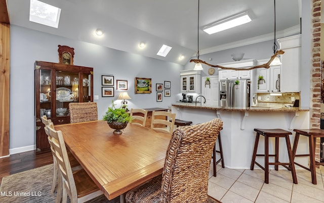 3 Carriage Court Pl, Brandon, MS 39047 - dining room featuring a skylight, ornamental molding, and vaulted ceiling