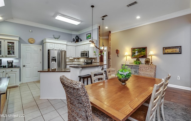 3 Carriage Court Pl, Brandon, MS 39047 - dining area featuring crown molding, light tile patterned flooring, baseboards, and recessed lighting