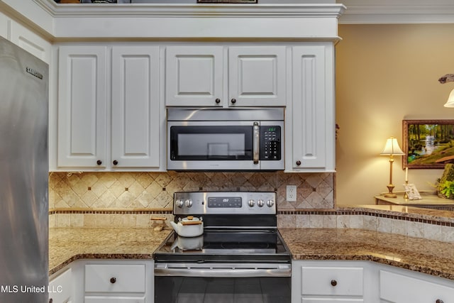 3 Carriage Court Pl, Brandon, MS 39047 - kitchen featuring appliances with stainless steel finishes, backsplash, white cabinets, ornamental molding, and tile patterned flooring