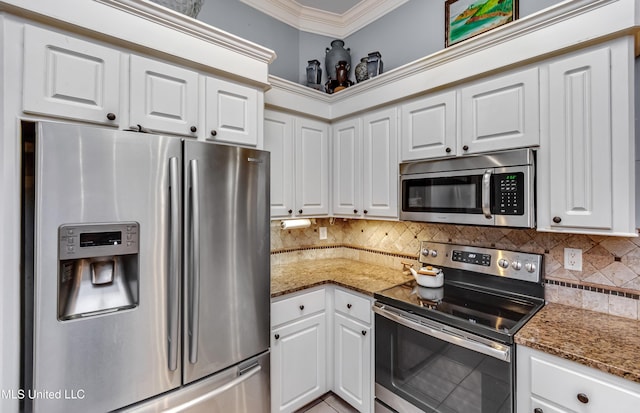 3 Carriage Court Pl, Brandon, MS 39047 - kitchen featuring appliances with stainless steel finishes, crown molding, decorative backsplash, white cabinets, and stone counters