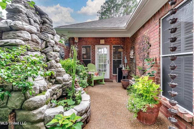 3 Carriage Court Pl, Brandon, MS 39047 - doorway to property featuring brick siding and roof with shingles