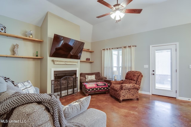 living room with concrete floors, a fireplace, baseboards, high vaulted ceiling, and a ceiling fan