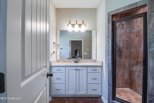 bathroom featuring vanity and a shower stall