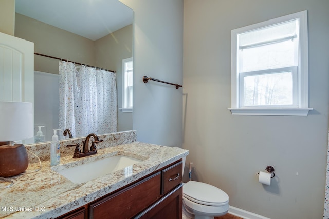 full bath with a shower with shower curtain, toilet, and vanity