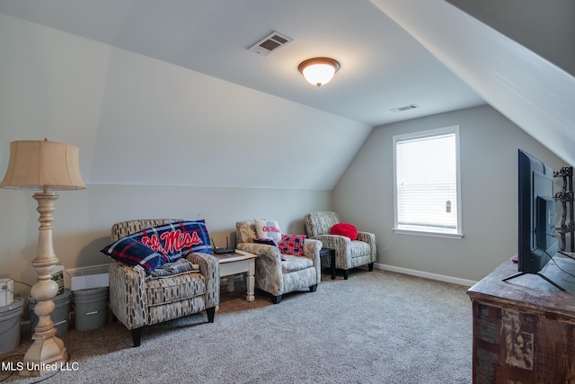 sitting room with lofted ceiling, visible vents, carpet, and baseboards