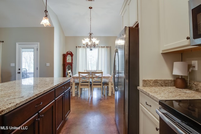kitchen with dark brown cabinetry, a chandelier, appliances with stainless steel finishes, white cabinets, and finished concrete floors
