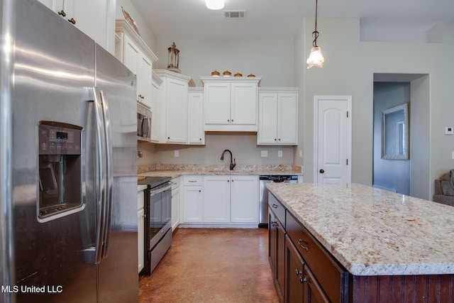 kitchen with stainless steel appliances, concrete floors, a sink, white cabinetry, and visible vents