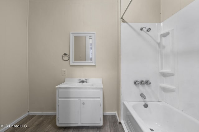 bathroom featuring vanity, wood-type flooring, and  shower combination