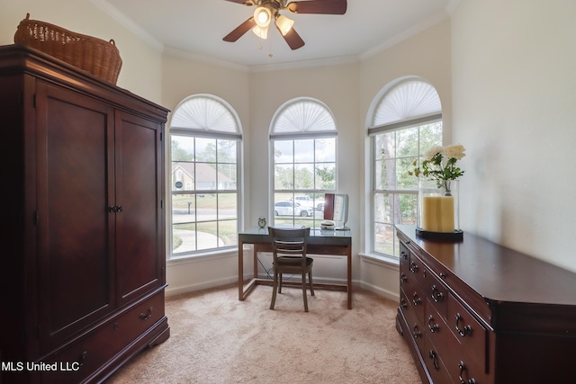 office with baseboards, light carpet, a ceiling fan, and crown molding