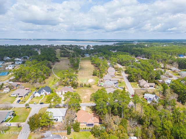 drone / aerial view featuring a residential view and a water view