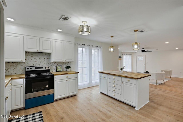 1505 Rosemont Dr, Clinton, MS 39056 - kitchen with butcher block countertops, stainless steel electric range oven, white cabinetry, light wood-type flooring, and tasteful backsplash