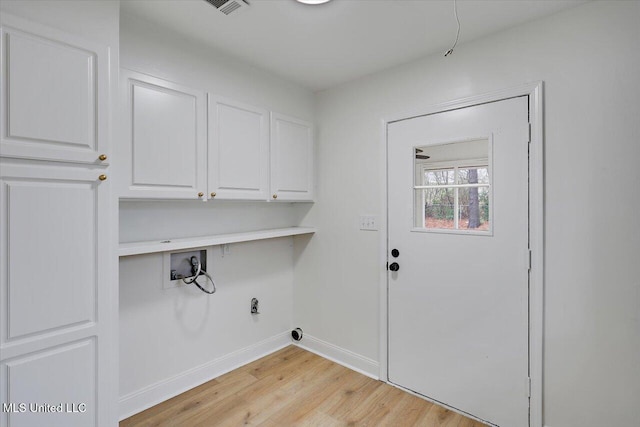 1505 Rosemont Dr, Clinton, MS 39056 - washroom with washer hookup, cabinet space, light wood-type flooring, and baseboards