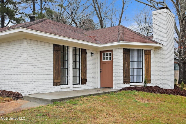 1505 Rosemont Dr, Clinton, MS 39056 - view of front facade featuring brick siding, a chimney, and a front yard