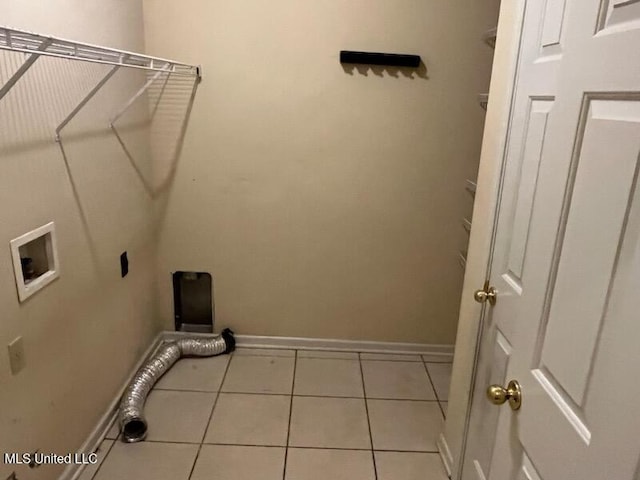 laundry area with hookup for a washing machine and light tile patterned floors