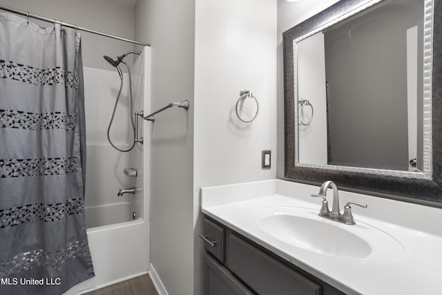 bathroom with vanity, shower / tub combo with curtain, and wood finished floors