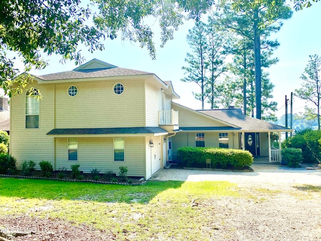 view of front of house featuring a front yard and covered porch