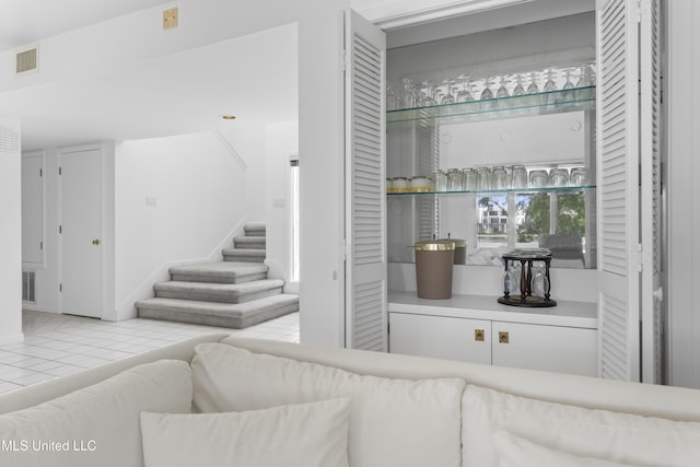 11 Bayou Pl, Gulfport, MS 39503 - tiled living area featuring stairs and bar