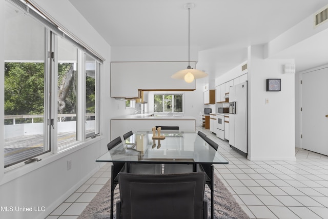 11 Bayou Pl, Gulfport, MS 39503 - dining area featuring light tile patterned flooring and baseboards