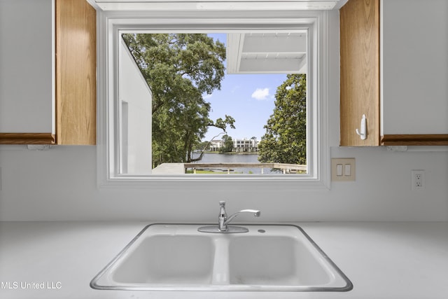 11 Bayou Pl, Gulfport, MS 39503 - kitchen with a sink, light countertops, and a water view