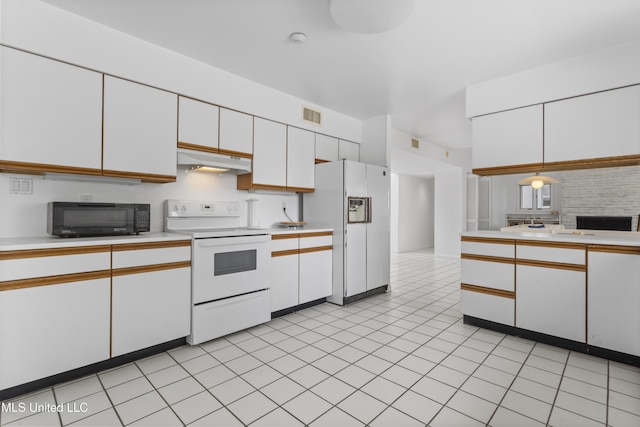 11 Bayou Pl, Gulfport, MS 39503 - kitchen featuring white appliances, under cabinet range hood, light countertops, and white cabinets