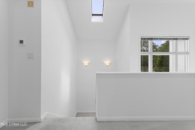 11 Bayou Pl, Gulfport, MS 39503 - empty room with a skylight, baseboards, and lofted ceiling