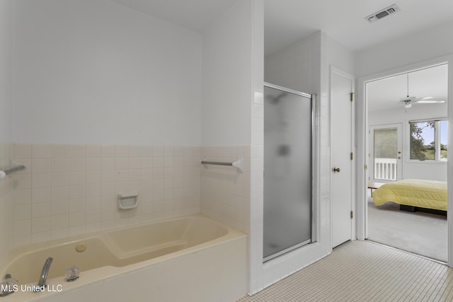 11 Bayou Pl, Gulfport, MS 39503 - bathroom featuring a bath, connected bathroom, a shower stall, tile patterned floors, and a ceiling fan