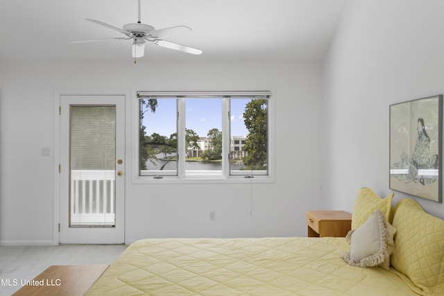 11 Bayou Pl, Gulfport, MS 39503 - carpeted bedroom with access to outside and ceiling fan