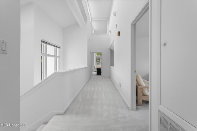 11 Bayou Pl, Gulfport, MS 39503 - corridor with carpet, a towering ceiling, and baseboards