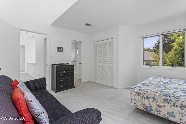 11 Bayou Pl, Gulfport, MS 39503 - bedroom with light carpet, a closet, and baseboards