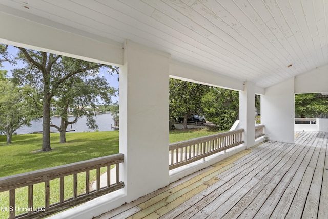 11 Bayou Pl, Gulfport, MS 39503 - wooden porch featuring a water view and a lawn