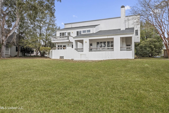 11 Bayou Pl, Gulfport, MS 39503 - back of property with a balcony, a yard, stucco siding, and a shingled roof