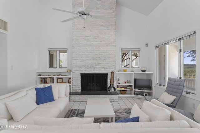 11 Bayou Pl, Gulfport, MS 39503 - living room featuring high vaulted ceiling, a fireplace, and a ceiling fan