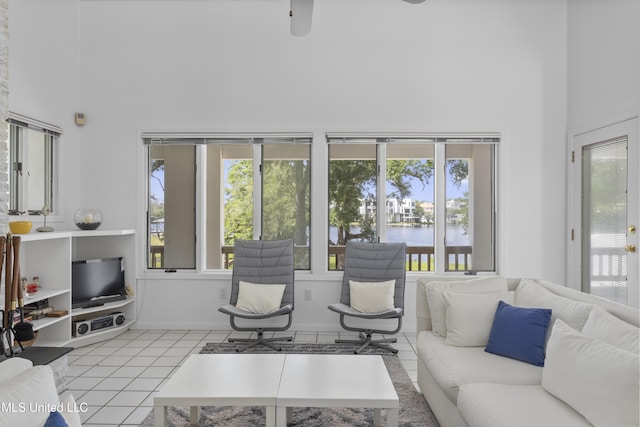 11 Bayou Pl, Gulfport, MS 39503 - tiled living area with a towering ceiling, plenty of natural light, a water view, and a ceiling fan