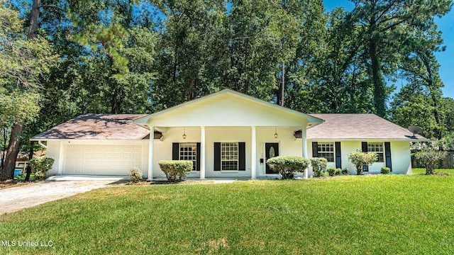 single story home featuring a garage, a front lawn, and covered porch