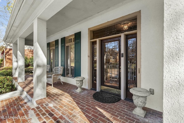 entrance to property featuring a porch