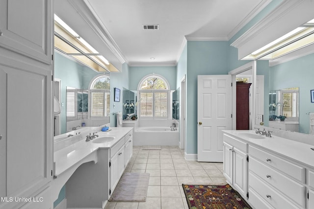 bathroom with a tub to relax in, tile patterned flooring, vanity, and ornamental molding