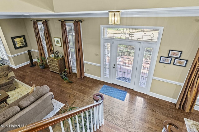 entryway with dark hardwood / wood-style flooring