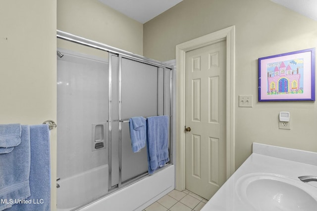 bathroom featuring tile patterned floors, vanity, and bath / shower combo with glass door